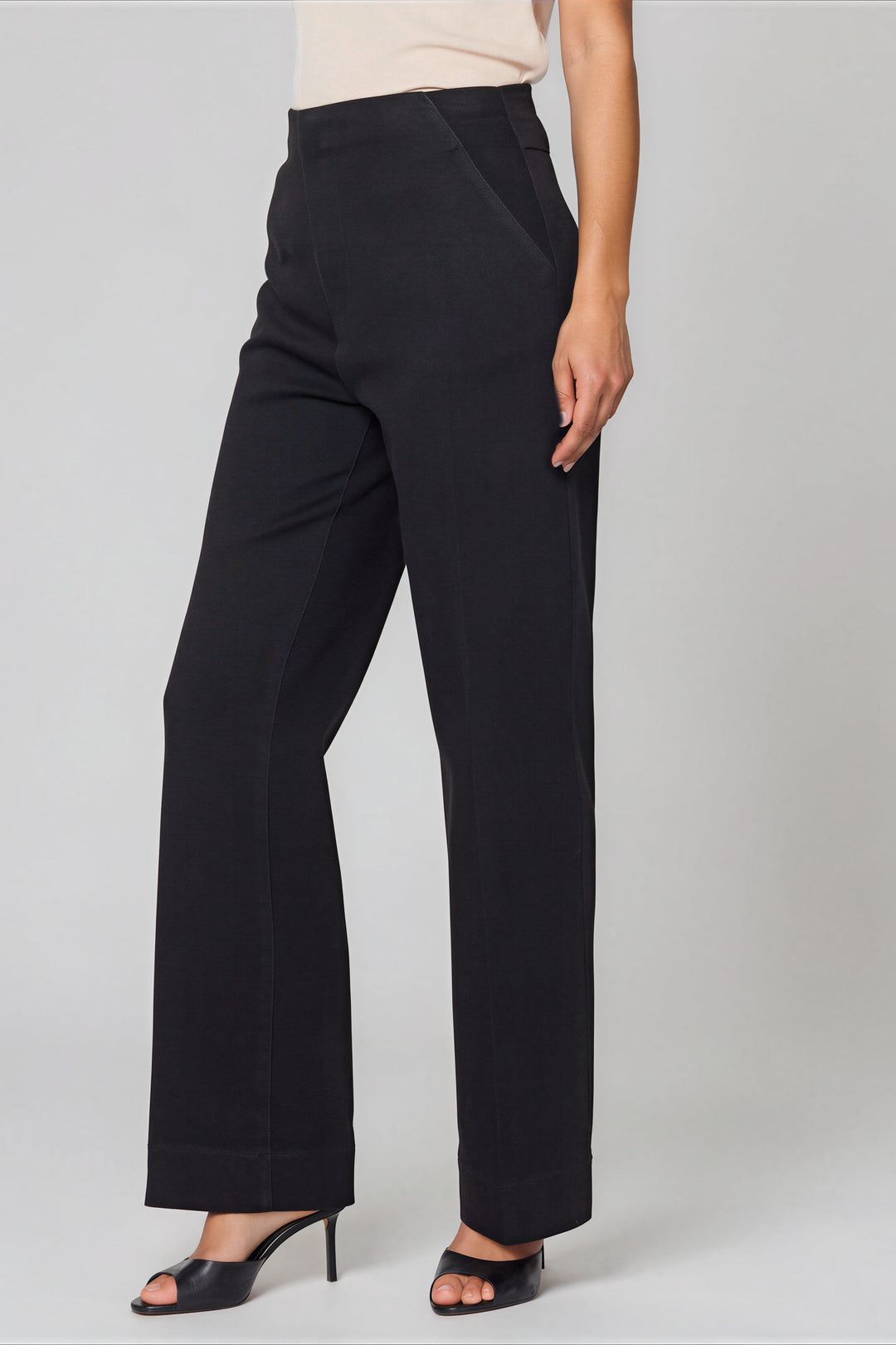 Black high-rise cropped jeans with a flared hem, back view