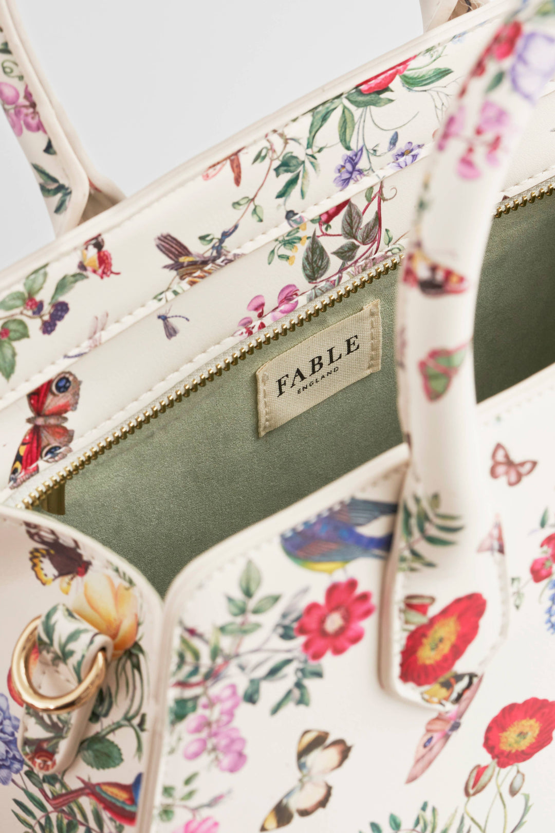Floral-patterned handbag with 'Fable' brand name on a light background