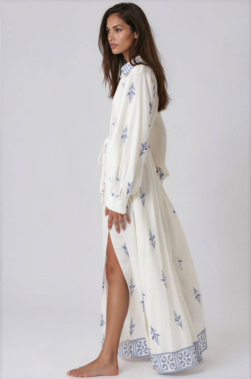 woman wearing ivory and blue long sleeve maxi dress