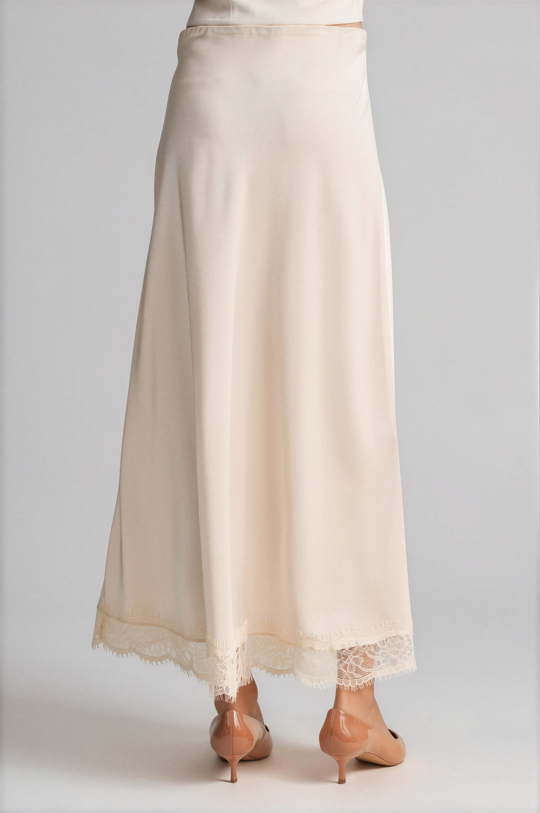 Cream satin skirt with a scalloped lace hem, detail
