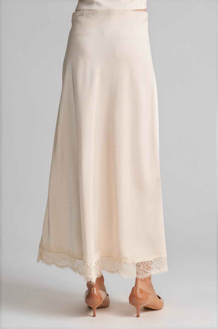 Cream satin skirt with a scalloped lace hem, detail