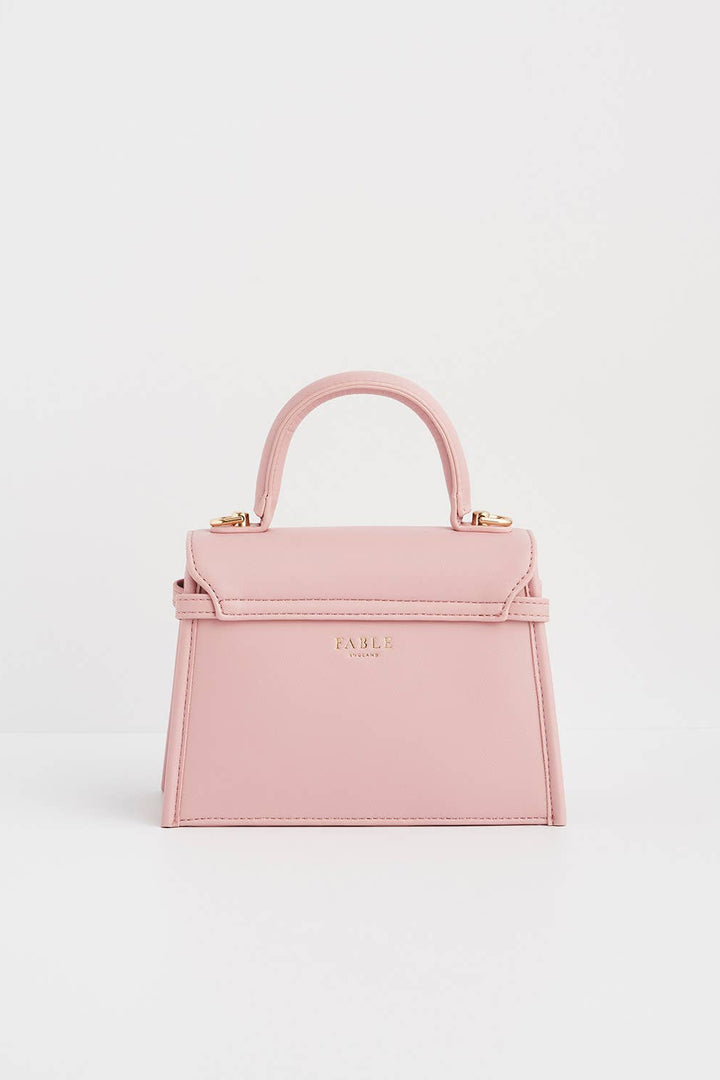 Pink handbag on a light gray background