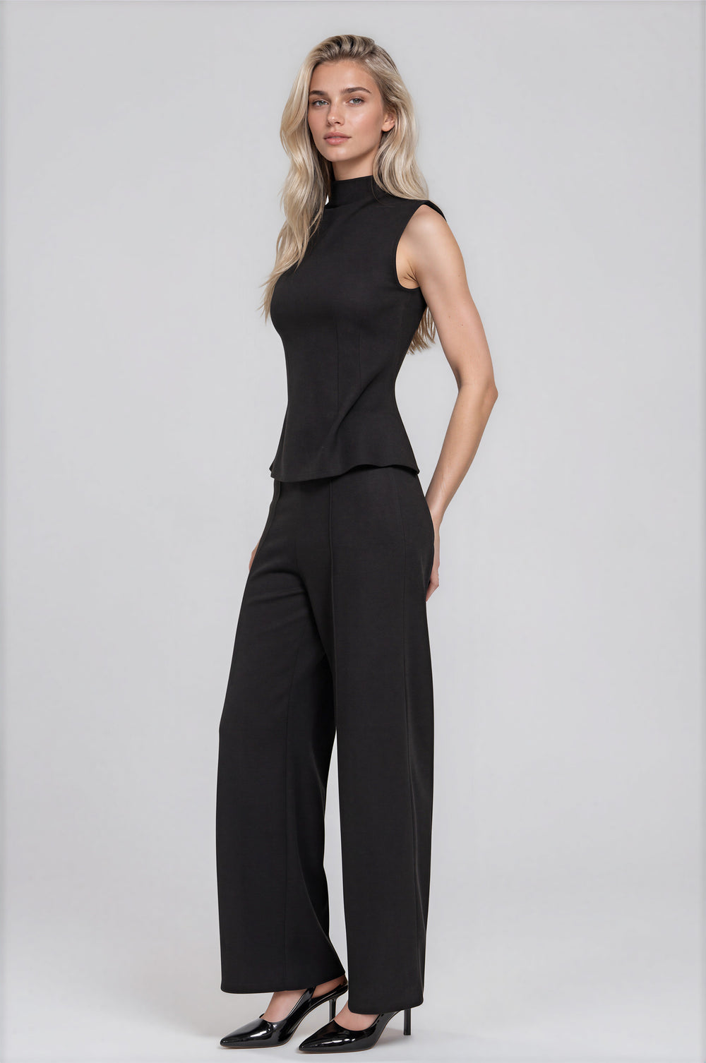 Black sleeveless high-neck brushed rib top with matching straight-leg pants