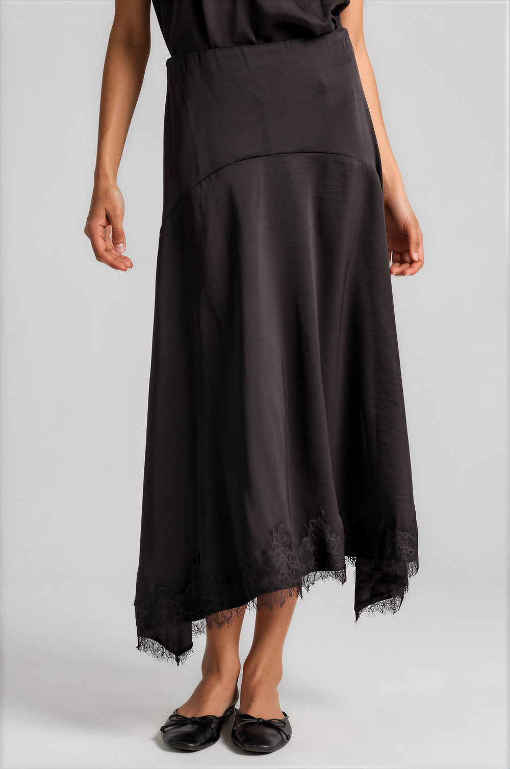 Chocolate bias-cut satin skirt with a handkerchief hem