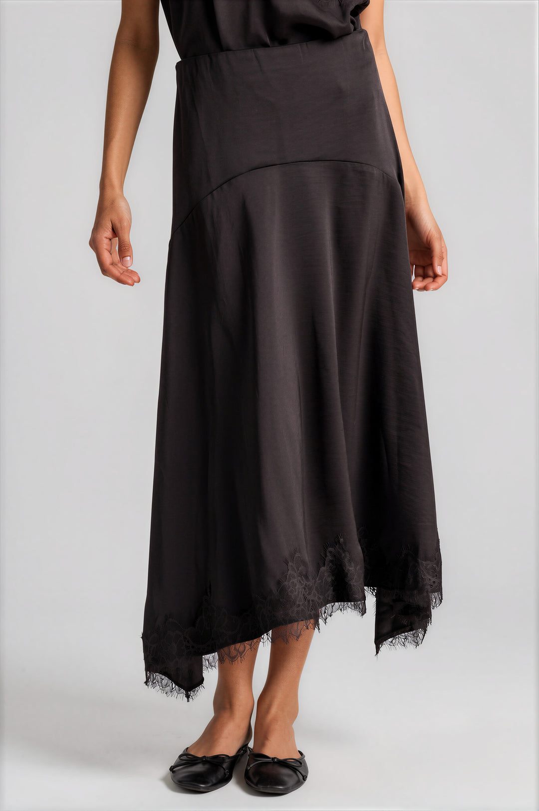 Chocolate bias-cut satin skirt with a handkerchief hem