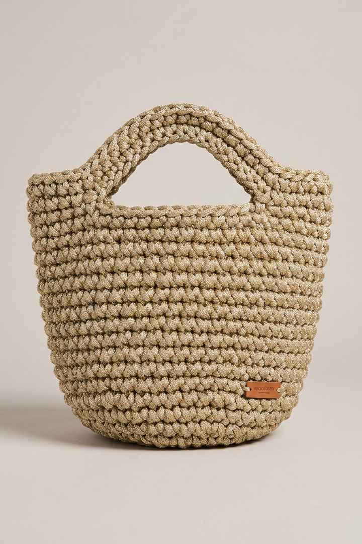Twyla Gold Crochet Top Handle Bag in metallic gold rope crochet with leather logo tag, front view