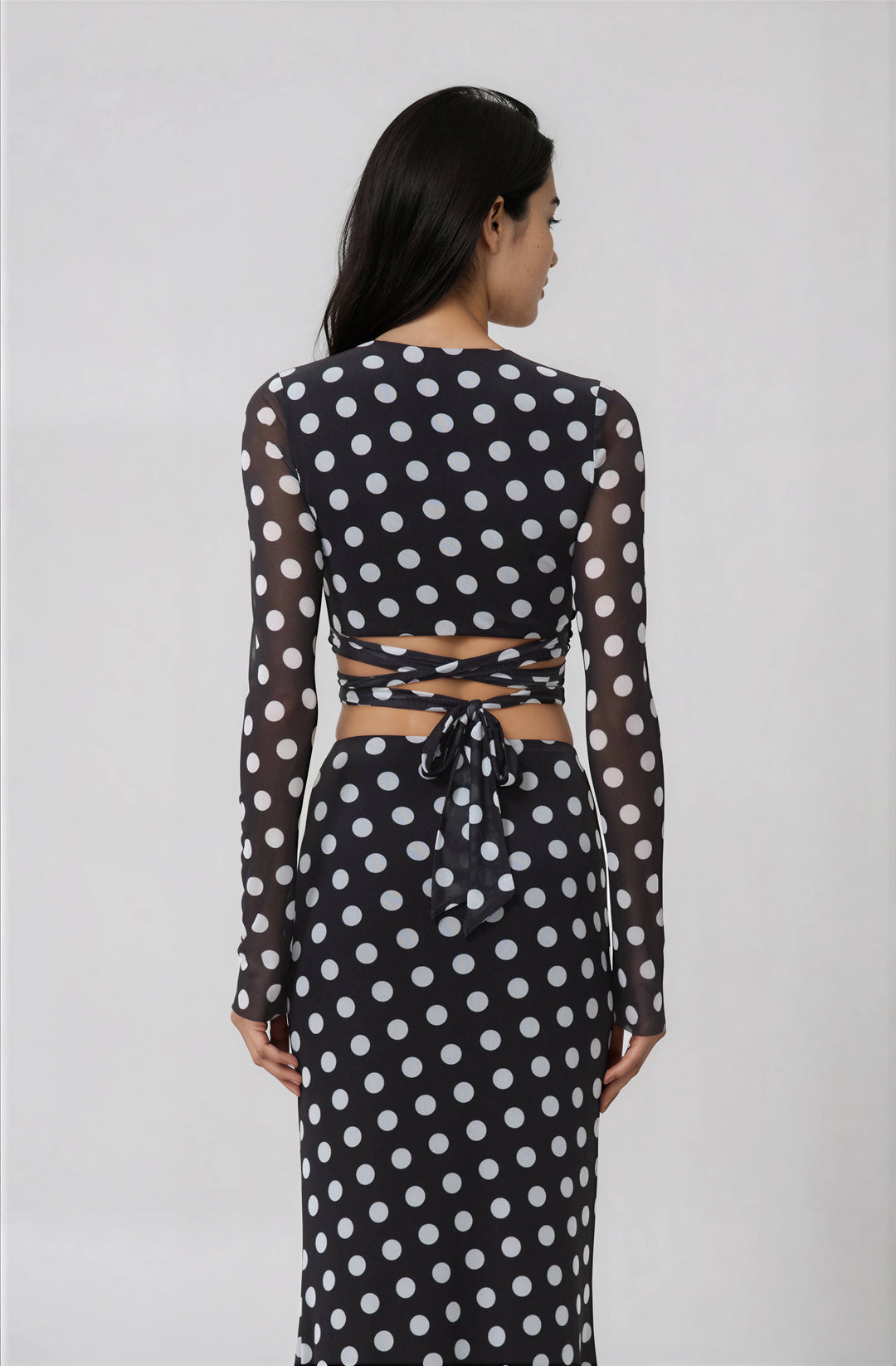 black and white polka dot mesh top with tie detail