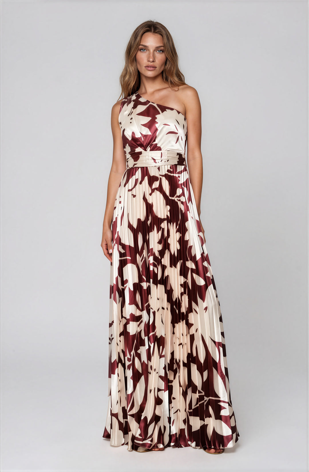 burgundy and cream one shoulder satin pleated gown with floral design