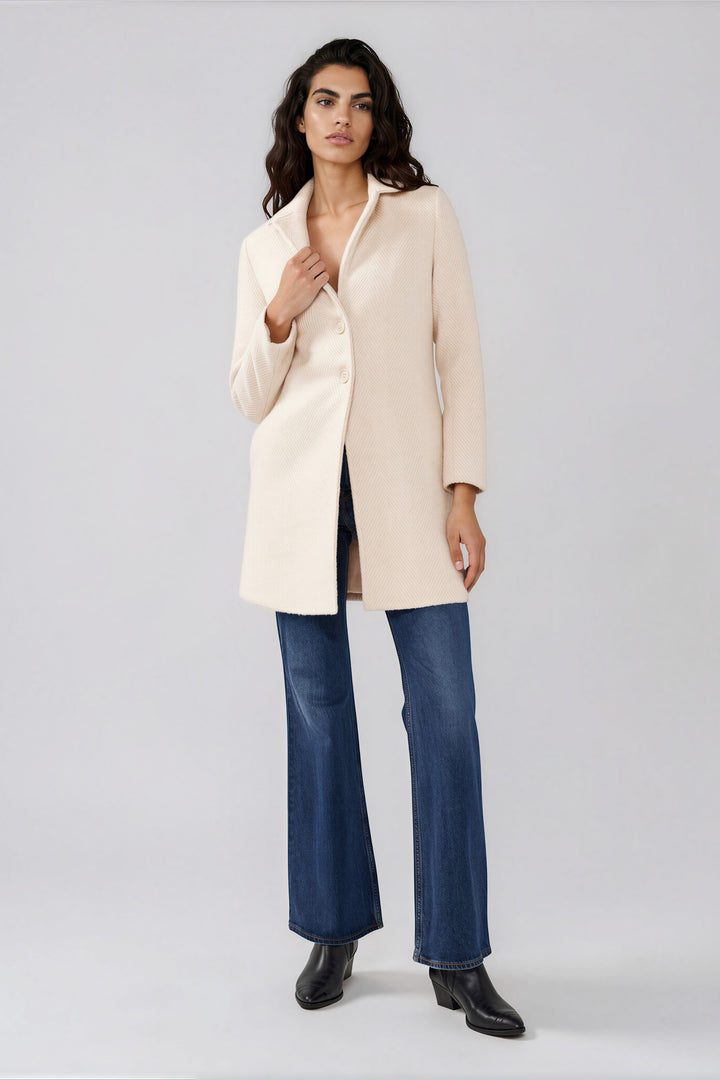 Cream chevron coat with long sleeves and side pockets