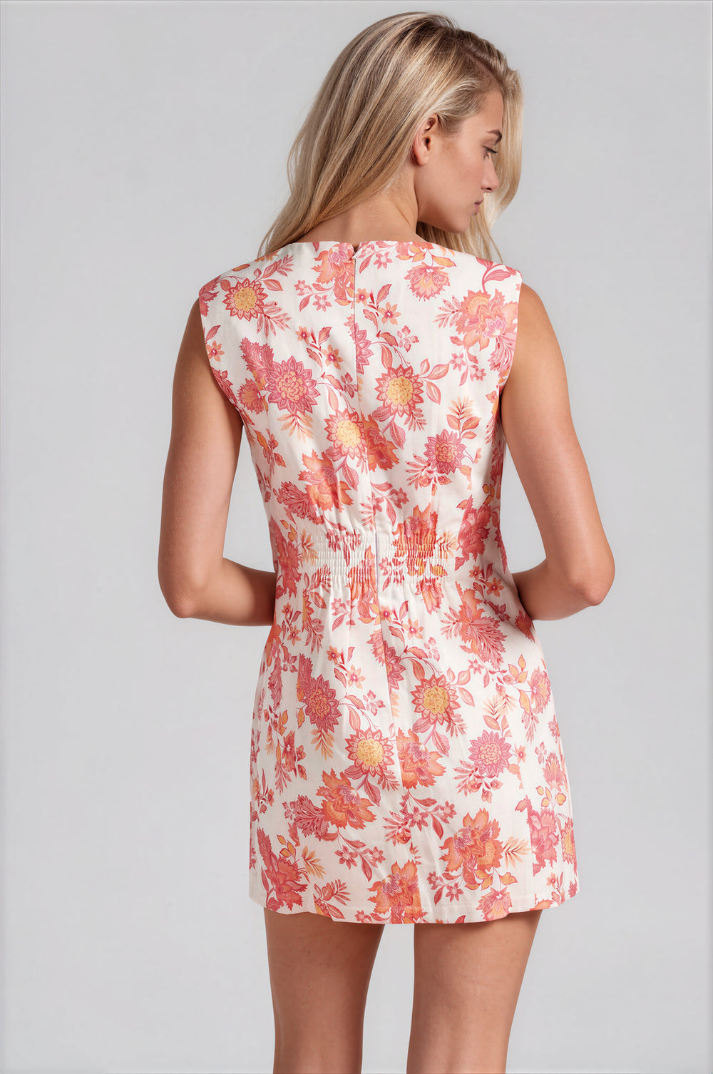 Pink floral print button-front mini dress with round neck and welt pockets