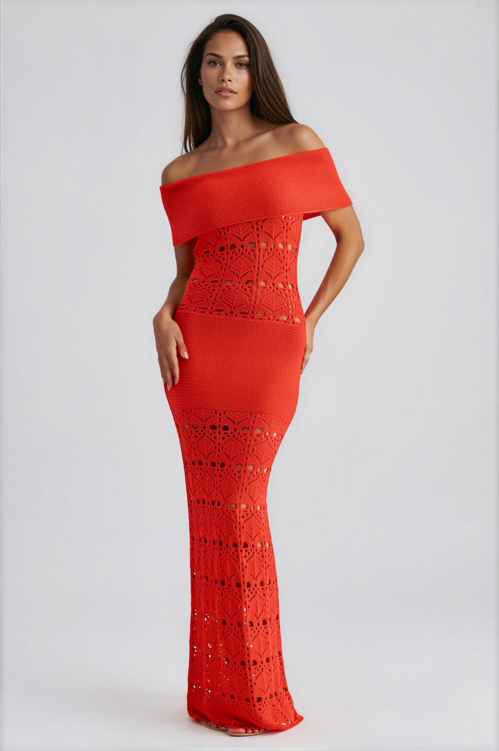 Woman wearing red off-shoulder crochet knit maxi dress with open-knit design
