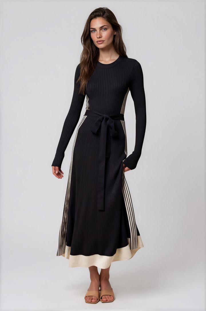 Woman wearing black color block long-sleeve knit maxi dress with tie belt