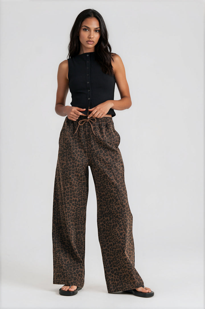 Woman wearing brown leopard print wide-leg drawstring pants