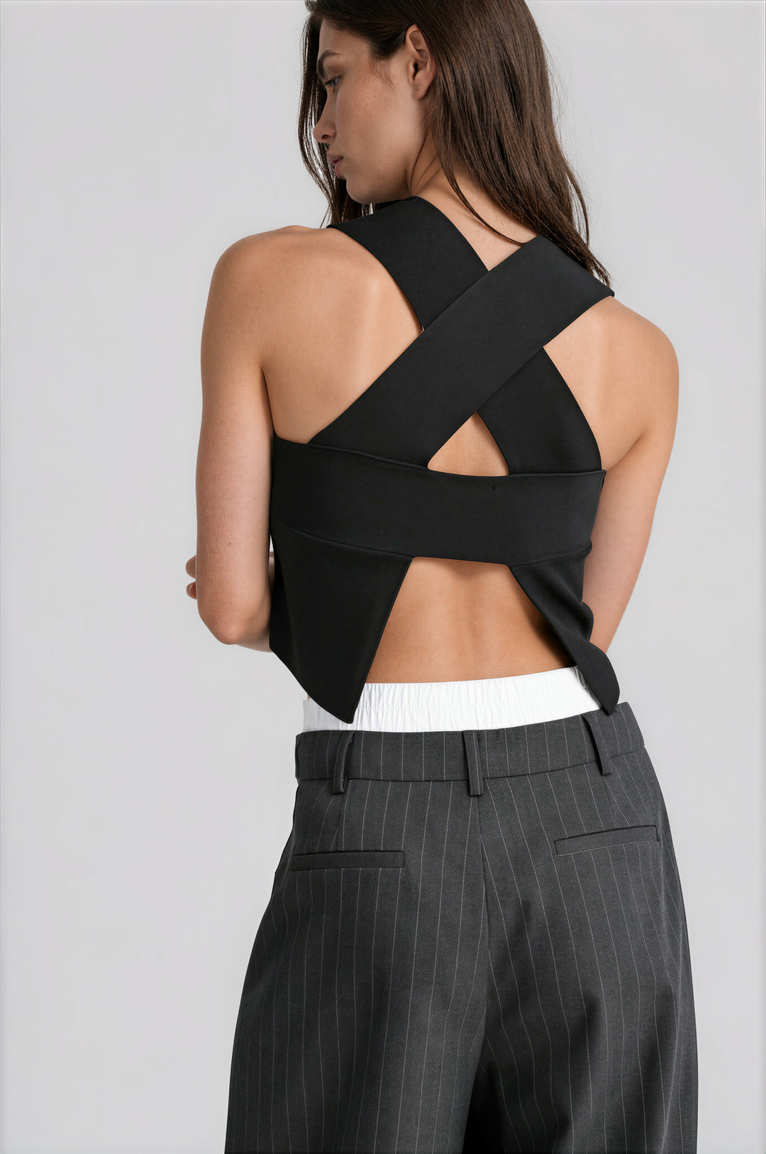 black sleeveless cropped top with intricate back detailing