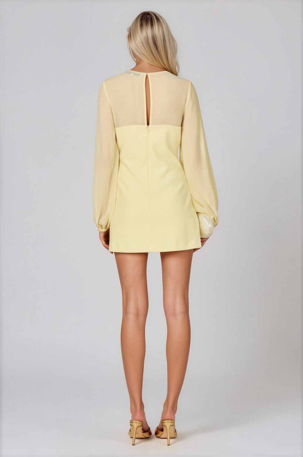 Pale yellow A-line mini dress with sheer gathered yoke and balloon sleeves