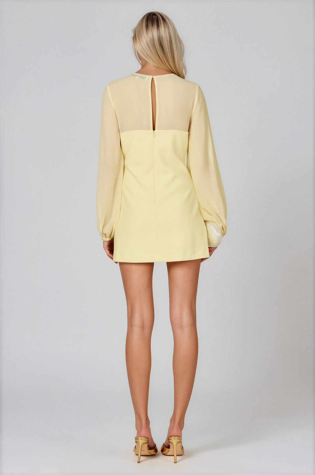 Pale yellow A-line mini dress with sheer gathered yoke and balloon sleeves