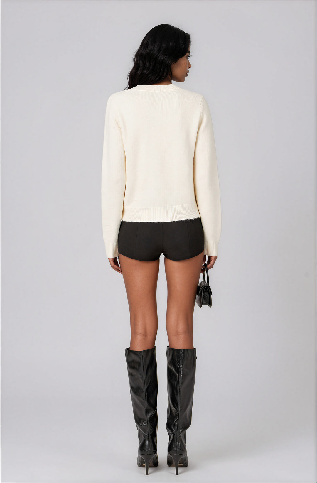 off white sweater with Apres text for ski trip back view