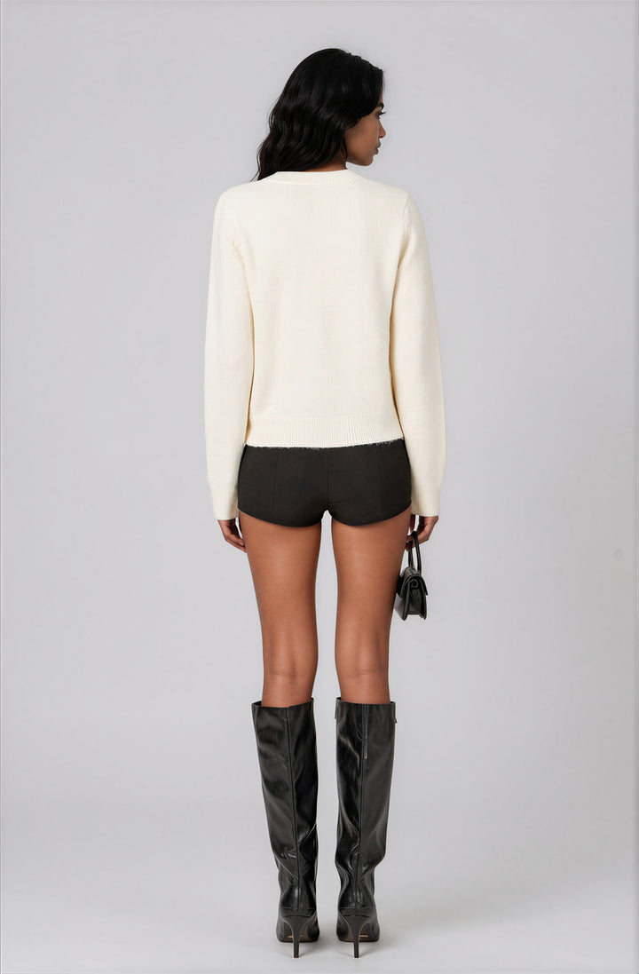 off white sweater with Apres text for ski trip back view