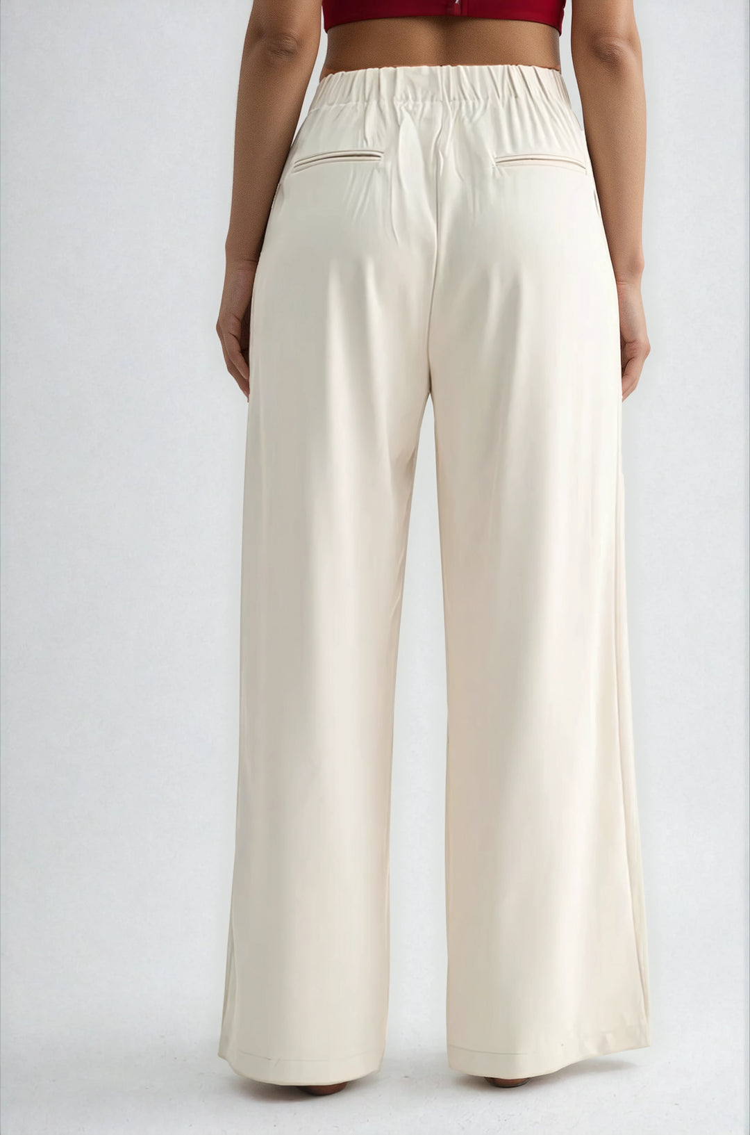 Beige wide-leg pants worn by a person on a white background