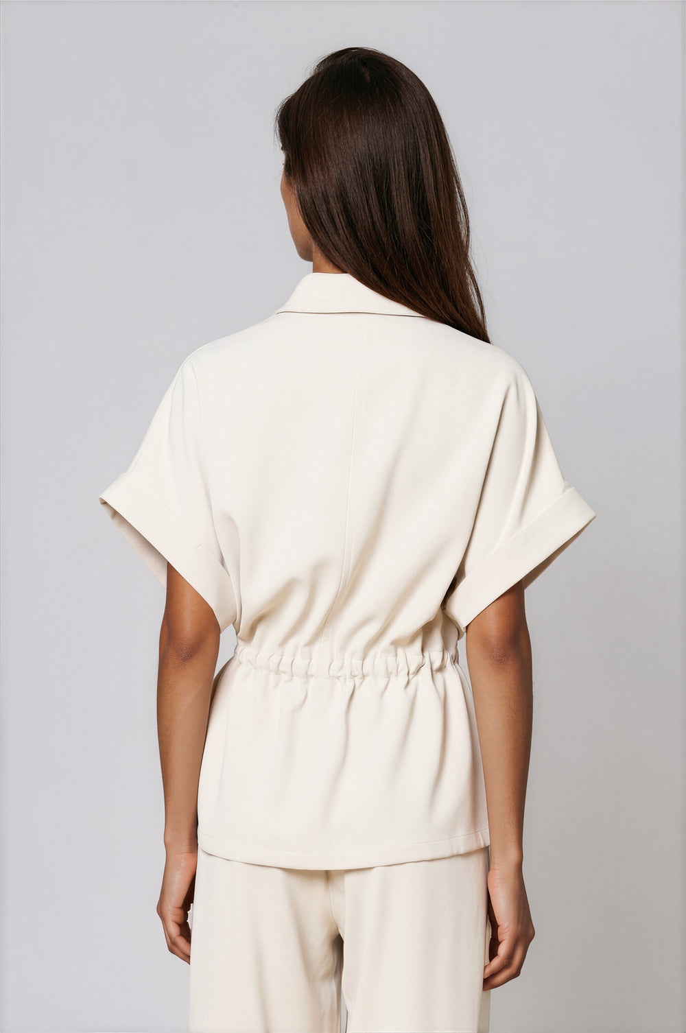 Cream two-piece set with collared zip-front dolman top and wide-leg pants
