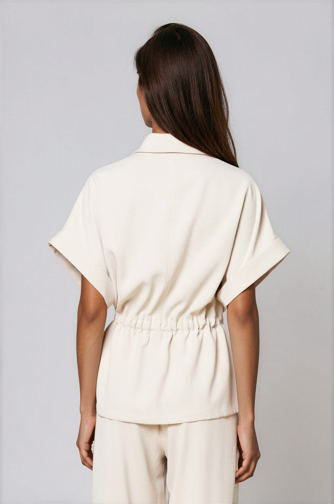 Cream two-piece set with collared zip-front dolman top and wide-leg pants
