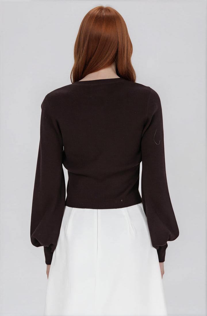 black cardigan sweater with scalloped hem back view