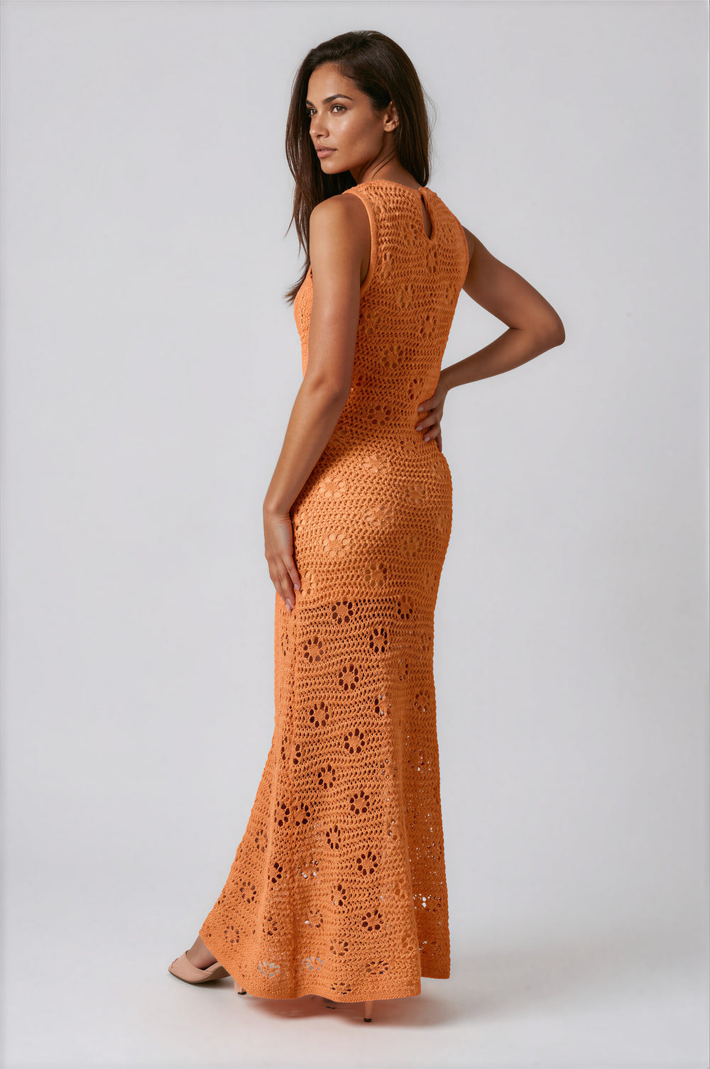 woman wearing orange crochet maxi dress