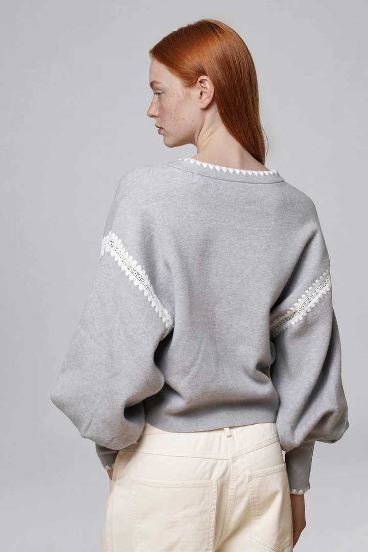Grey lace-trim cropped cardigan, sleeve and trim detail