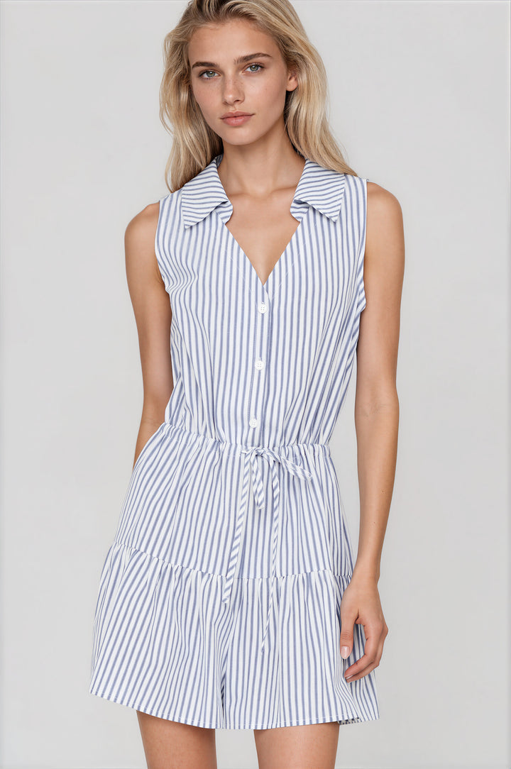 Woman wearing blue and white striped sleeveless romper with collar and button-down front