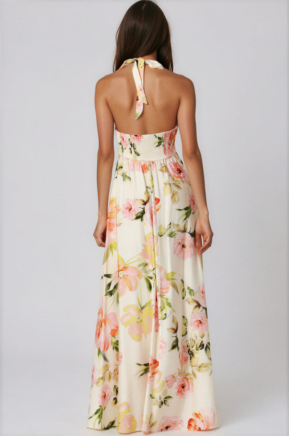woman wearing smock top ivory floral maxi dress