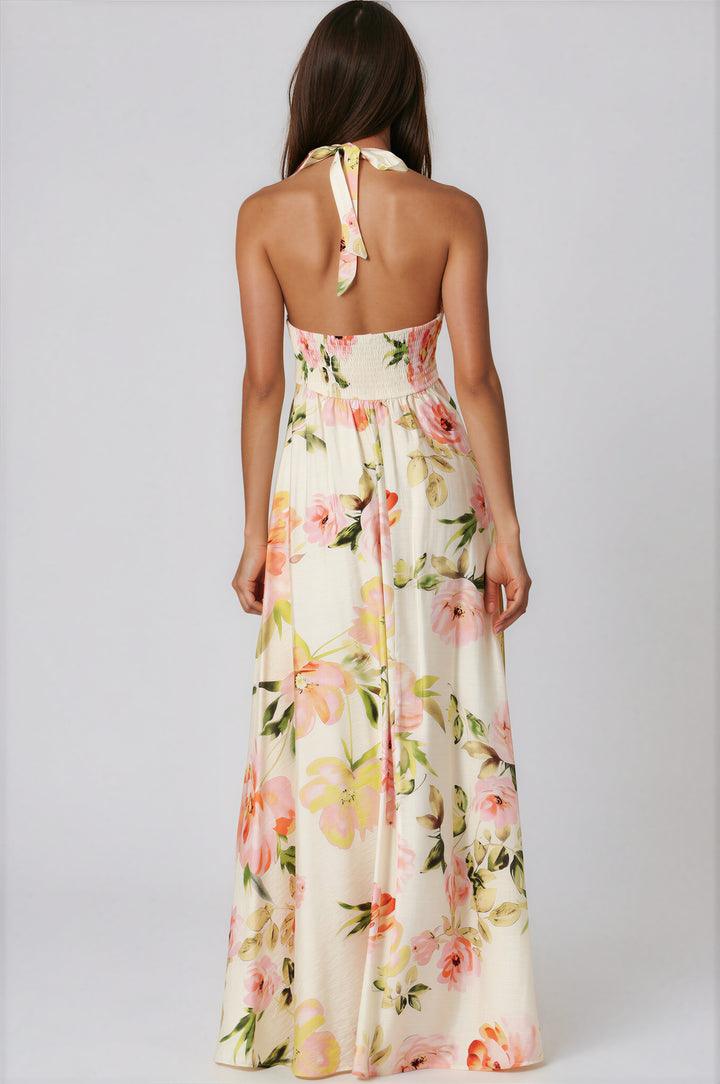woman wearing smock top ivory floral maxi dress