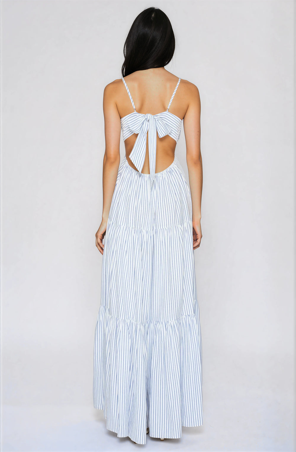 blue and white striped maxi dress with open back and bow detail
