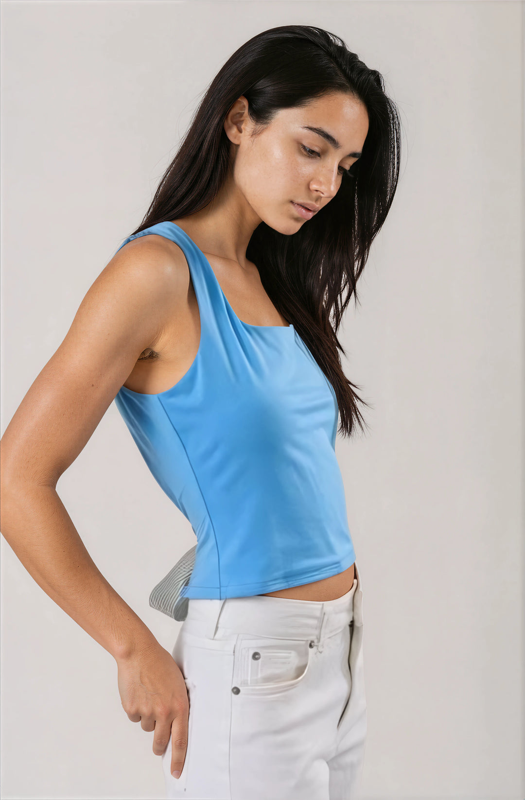 light blue women's top with open back and striped bow contrast