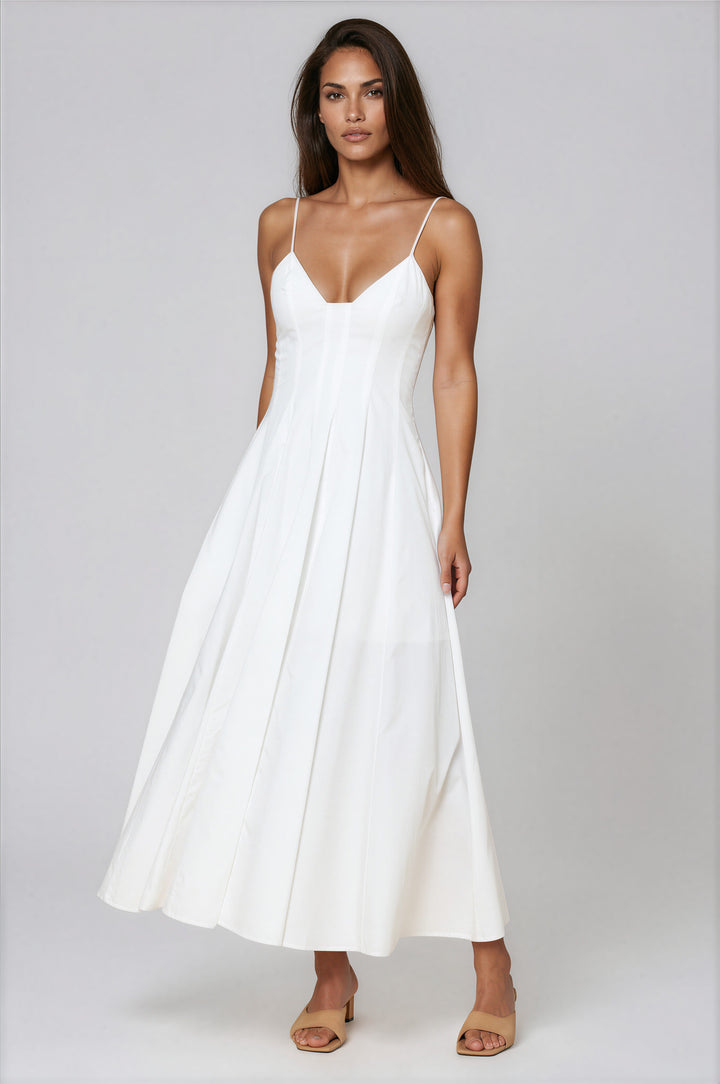 woman wearing a white cotton a-line maxi dress with sweetheart neckline
