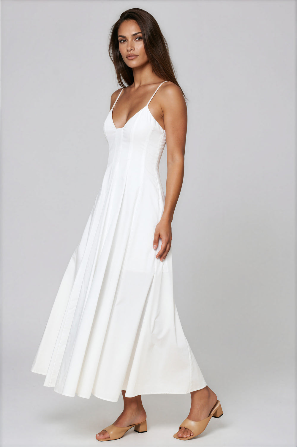woman wearing a white cotton a-line maxi dress with sweetheart neckline