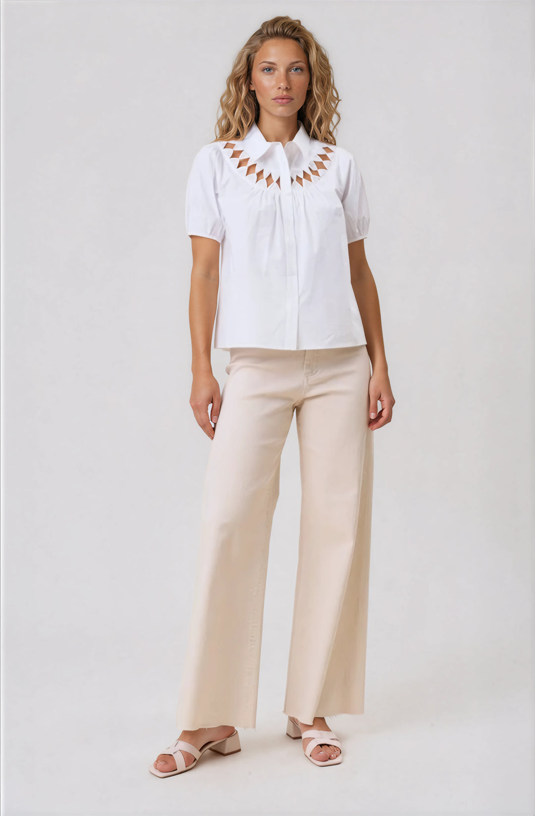 white short sleeve button down blouse with cutout detail