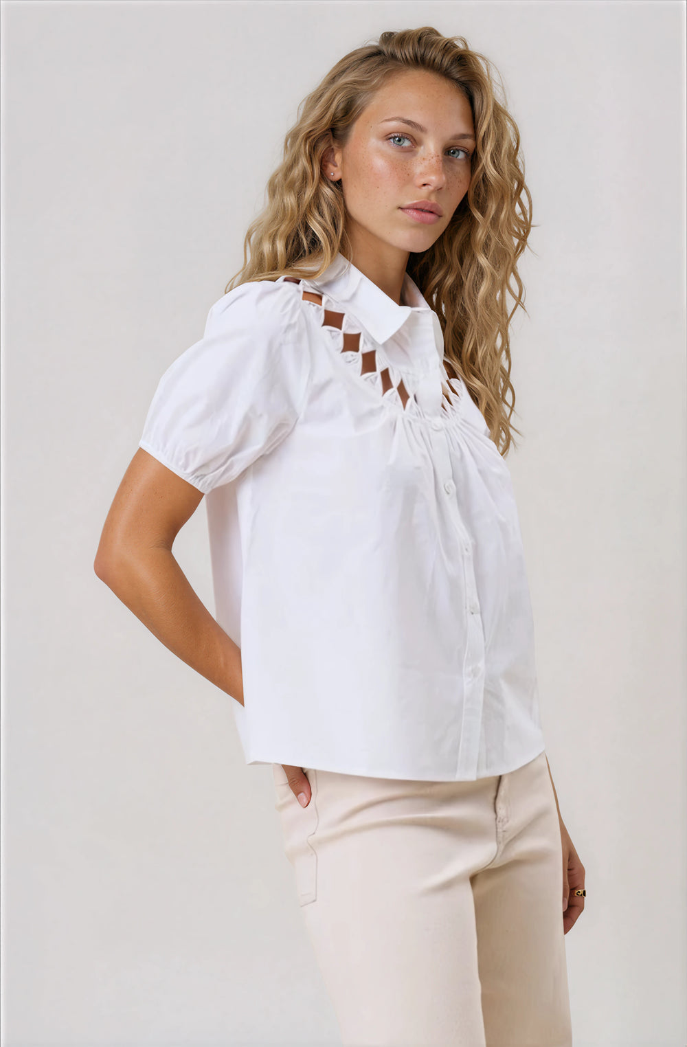 white short sleeve button down blouse with cutout detail
