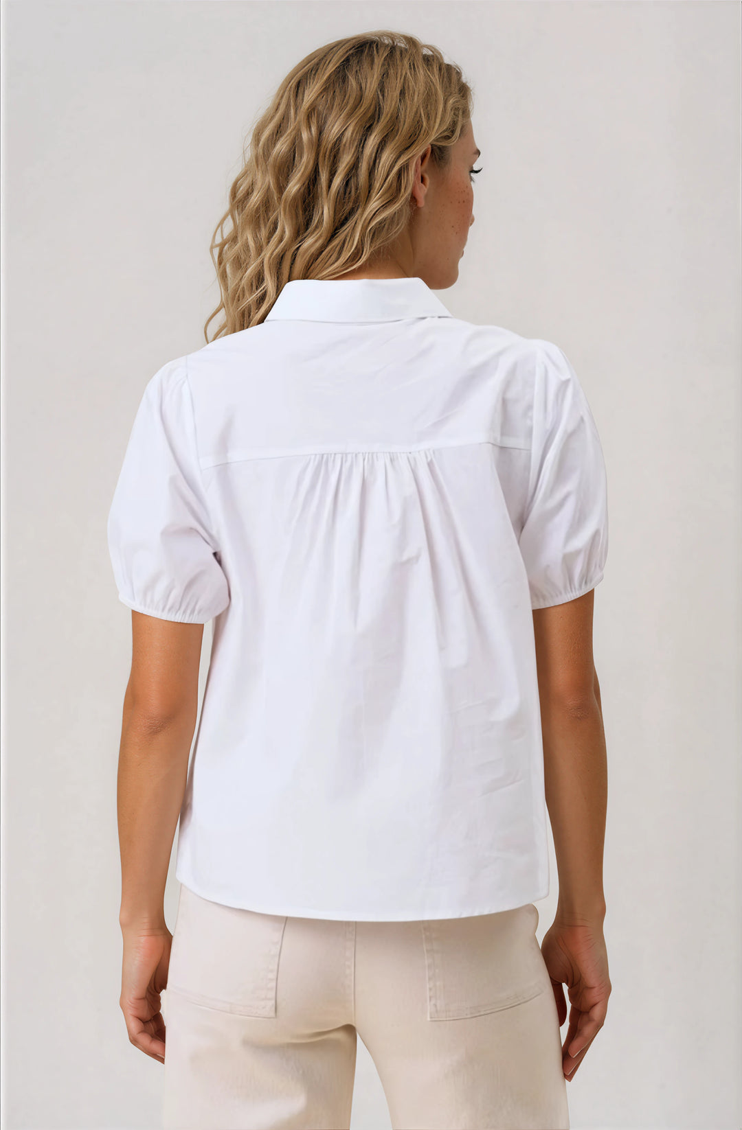 white short sleeve button down blouse with cutout detail back
