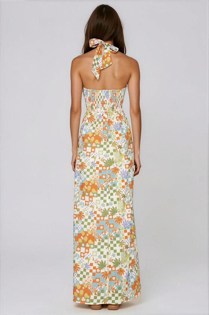 woman wearing floral print halter maxi dress