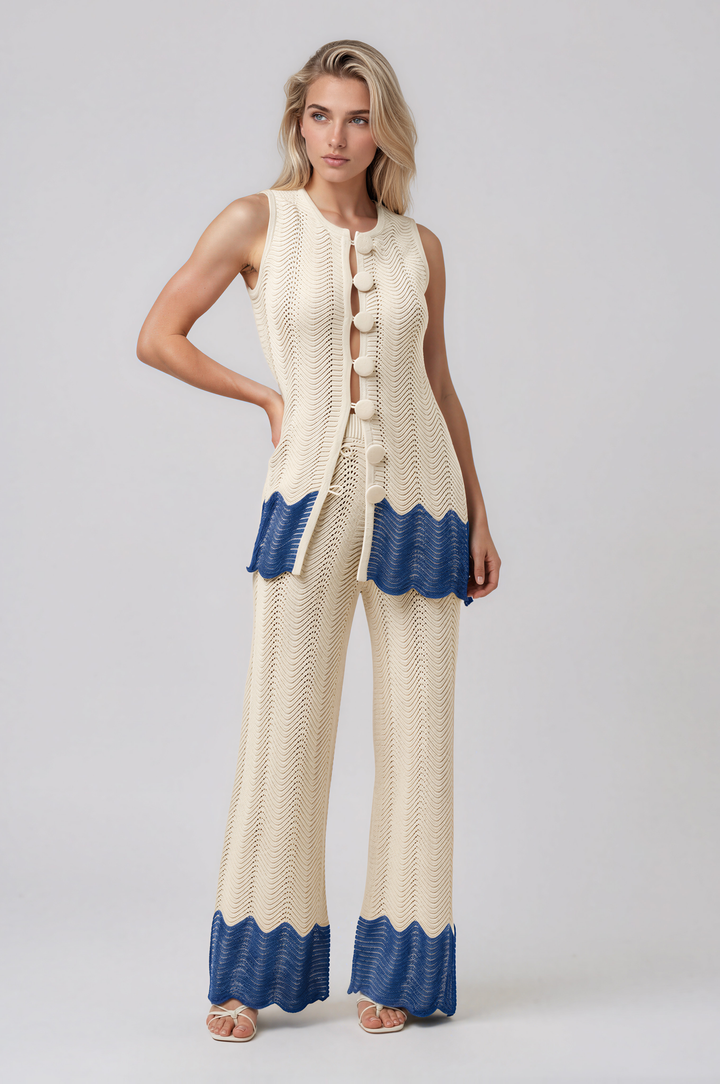 Woman wearing ivory open-knit button-front top and wide-leg pants set with blue wave hem