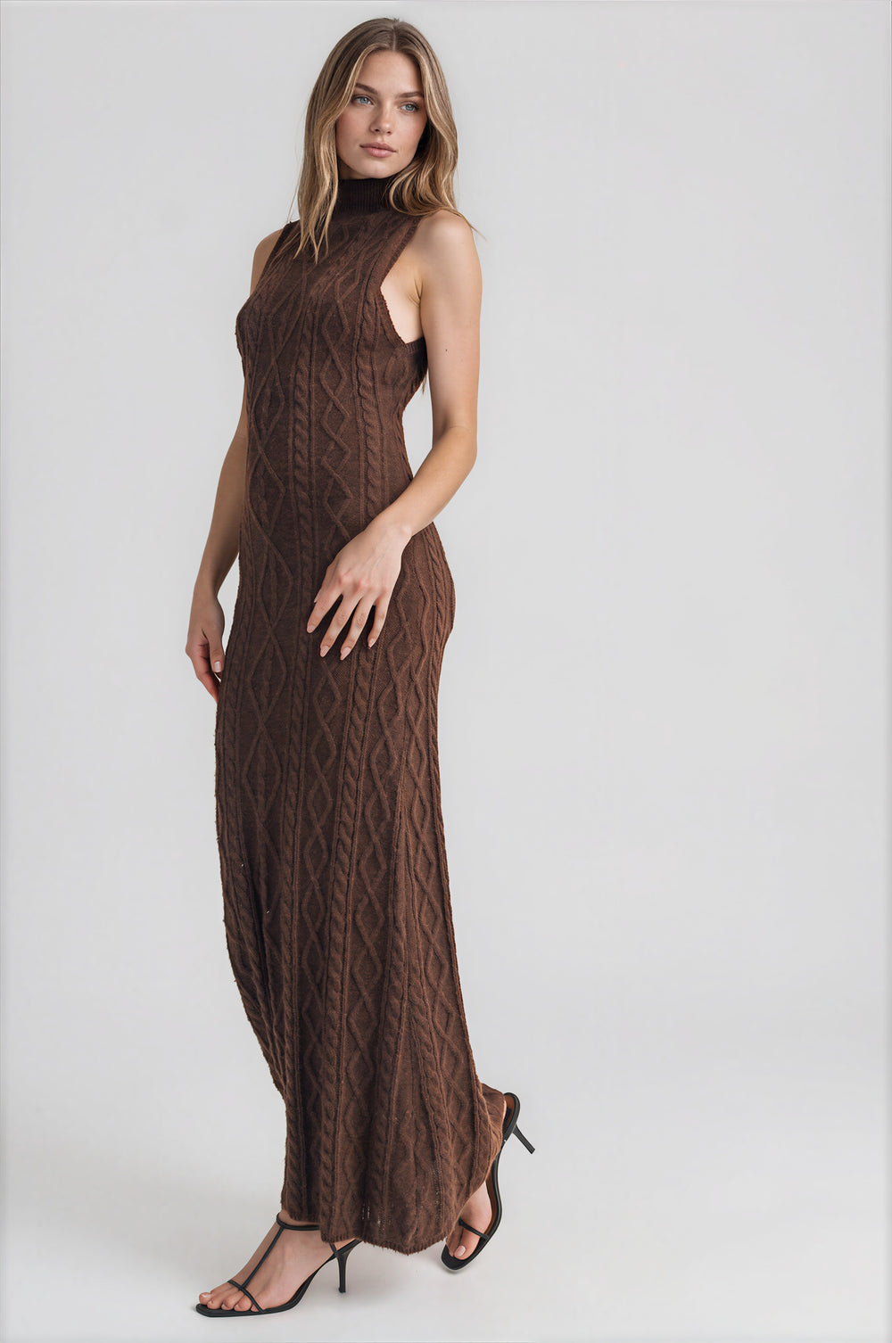 Brown cable knit turtleneck maxi dress with form-fitting silhouette