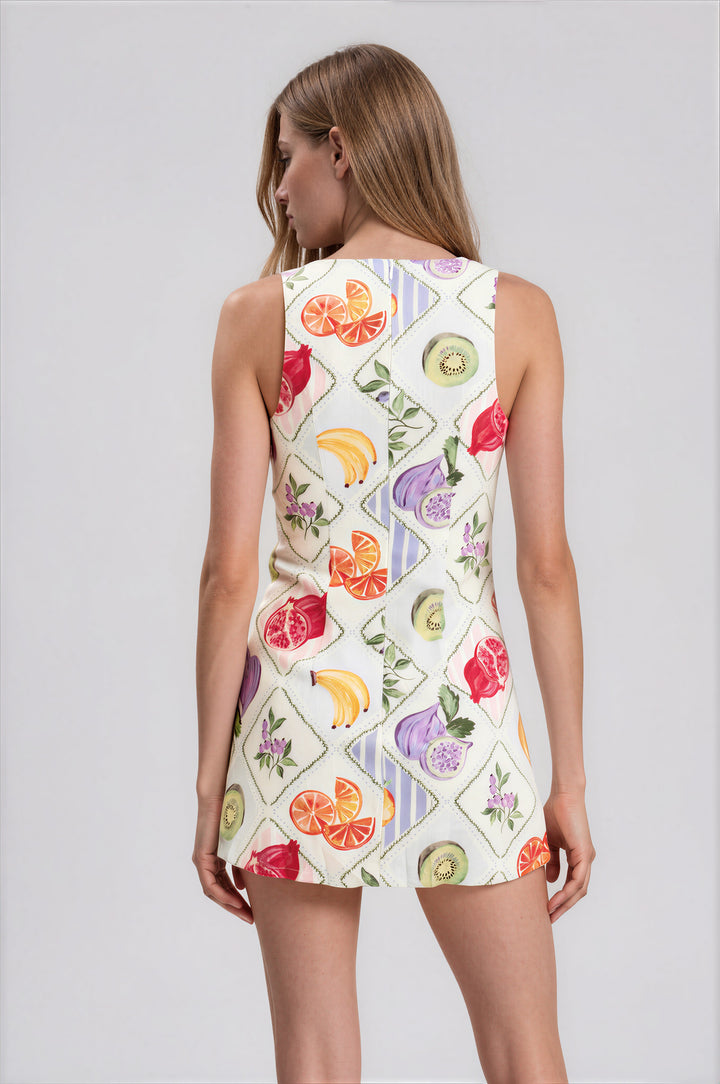 White harlequin fruit print sleeveless mini dress with built-in shorts