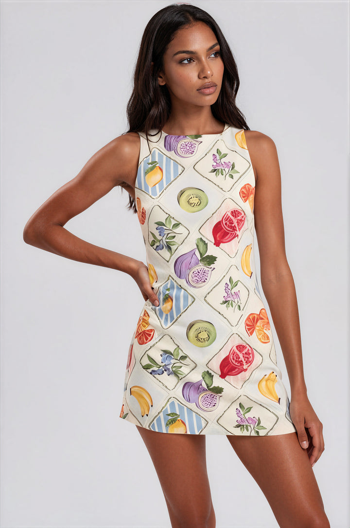 White fruit tile harlequin print mini dress with boat neckline