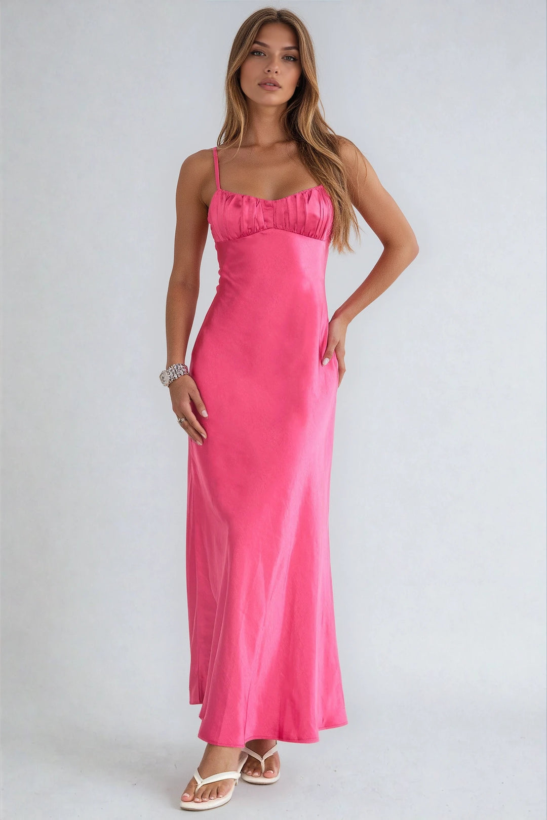 Woman wearing a pink dress on a white background