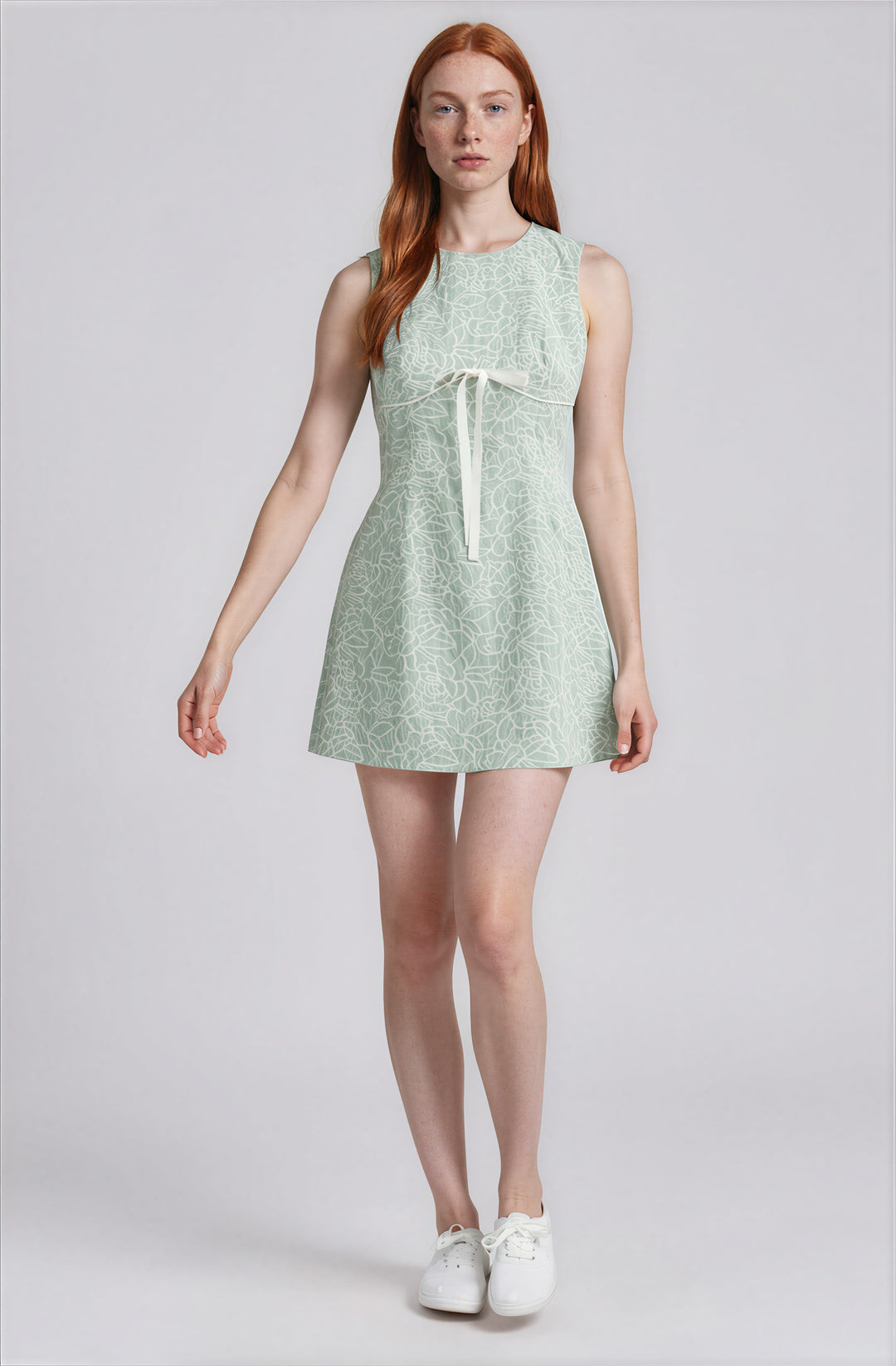 Mint green floral mini dress with bow detail