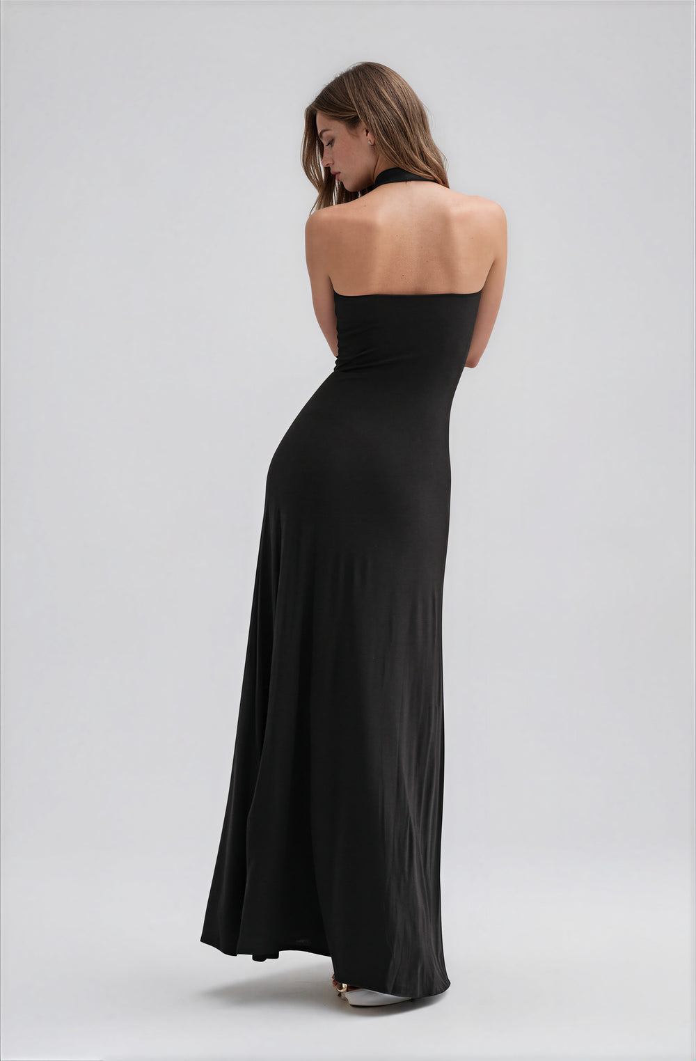 black plunge neckline gown with sash detail and open back