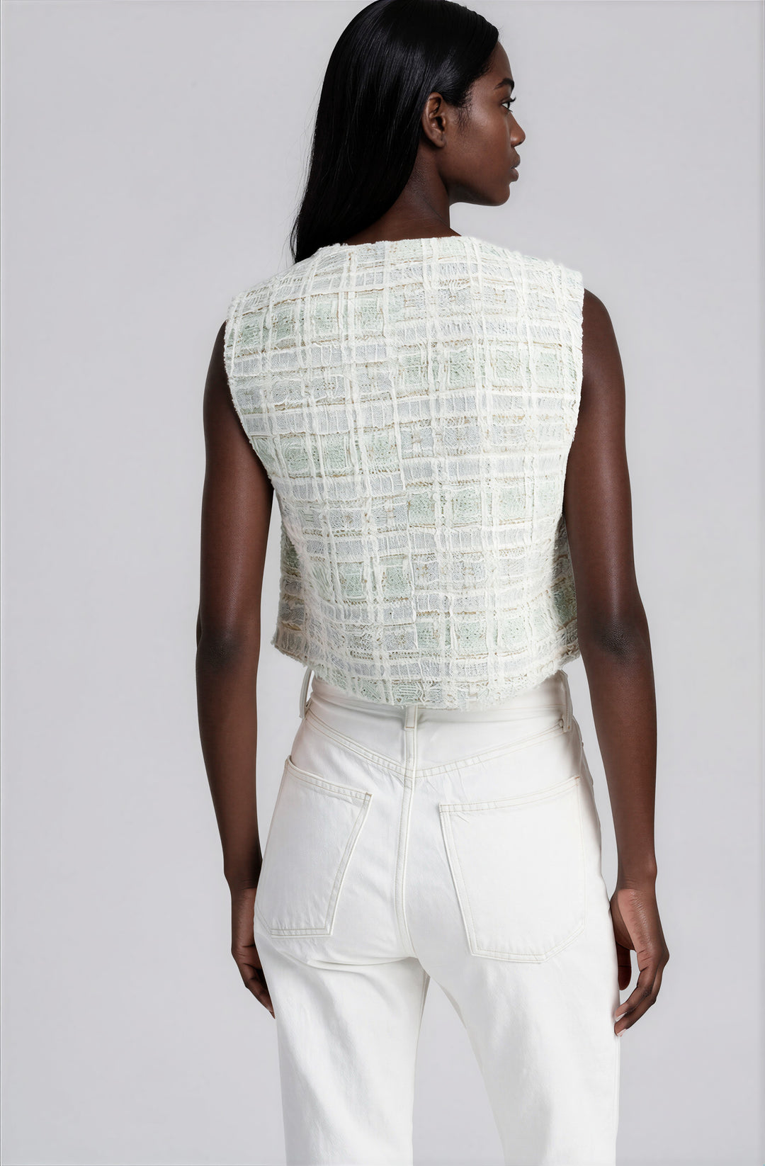 light green and white tweed sleeveless sweater vest with rhinestone buttons back view