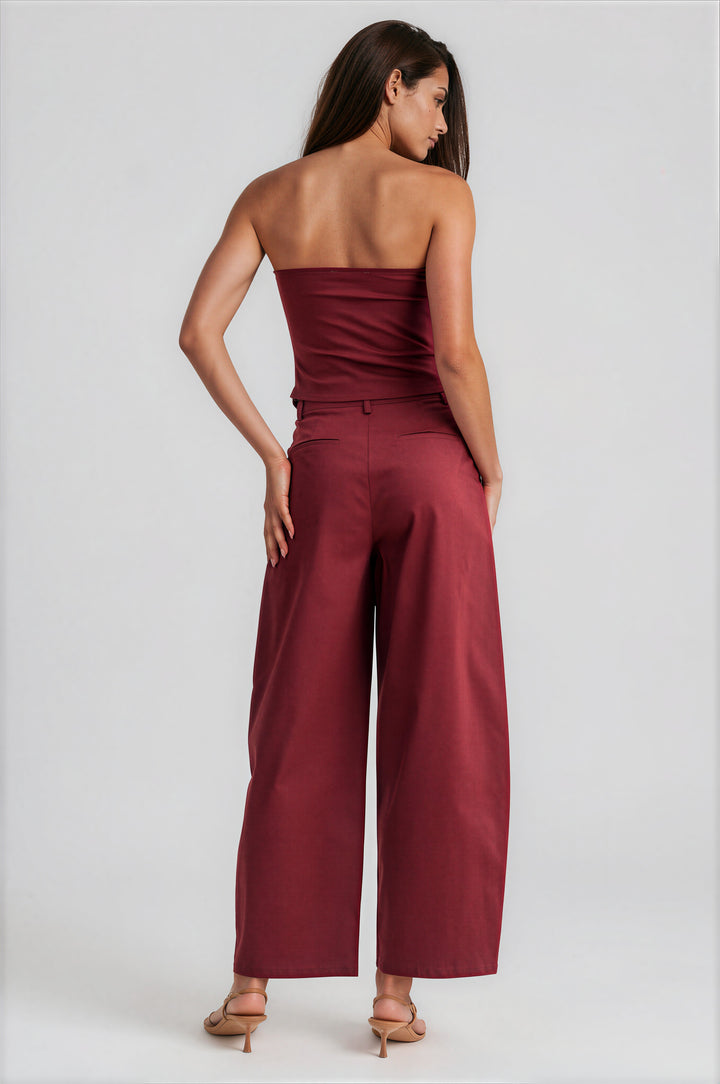 Burgundy strapless boned corset top with wide-leg pants