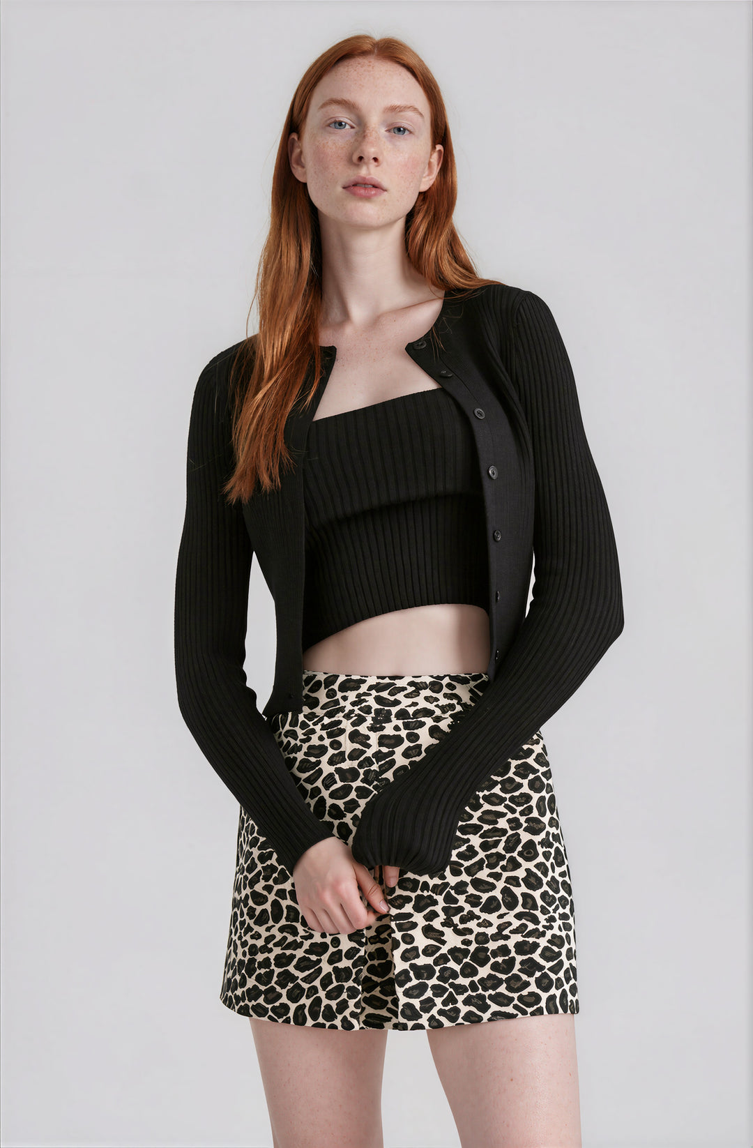black matching tube top and cardigan set with ribbed detail