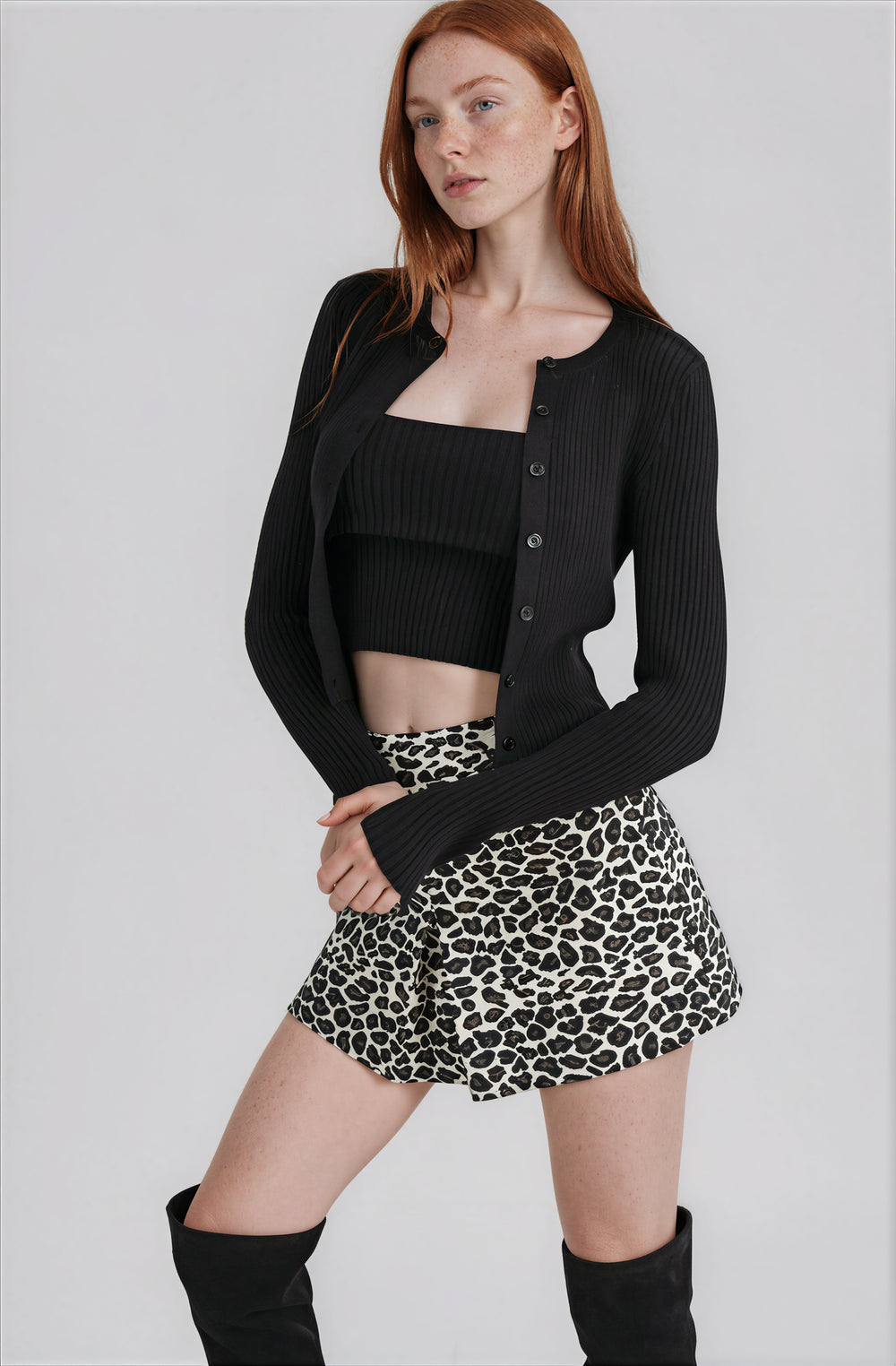black matching tube top and cardigan set with ribbed detail